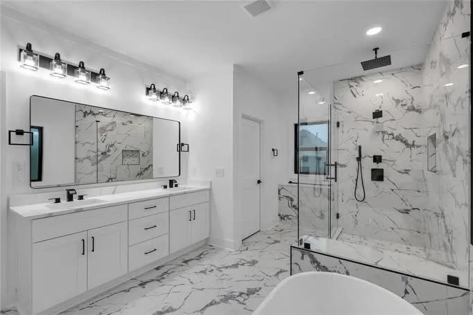 Luxury bathroom with double vanity and marble shower